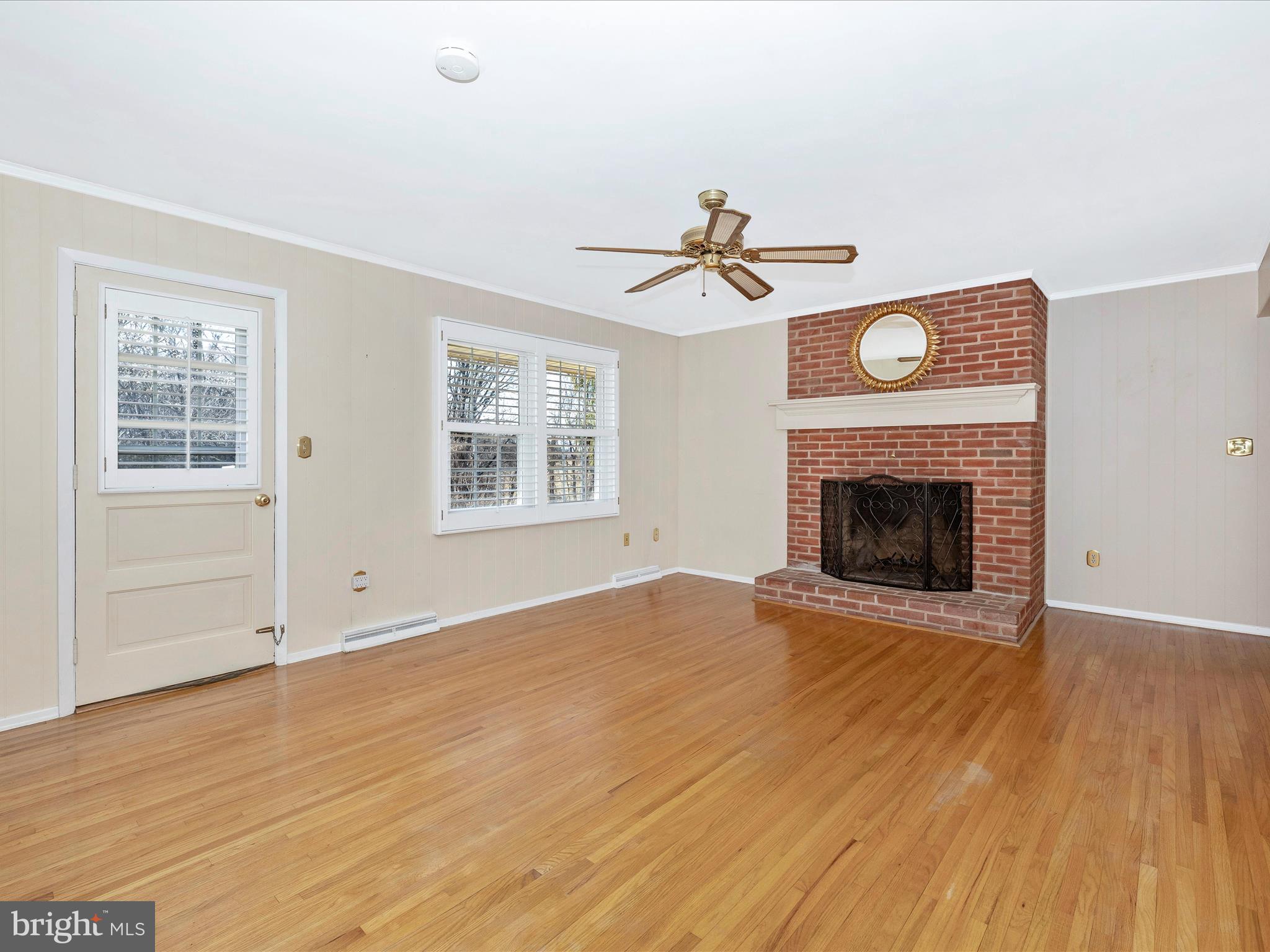 25204 Frederick Road Clarksburg, MD 20871 - Photo 20 of 58 an empty room with windows and fireplace