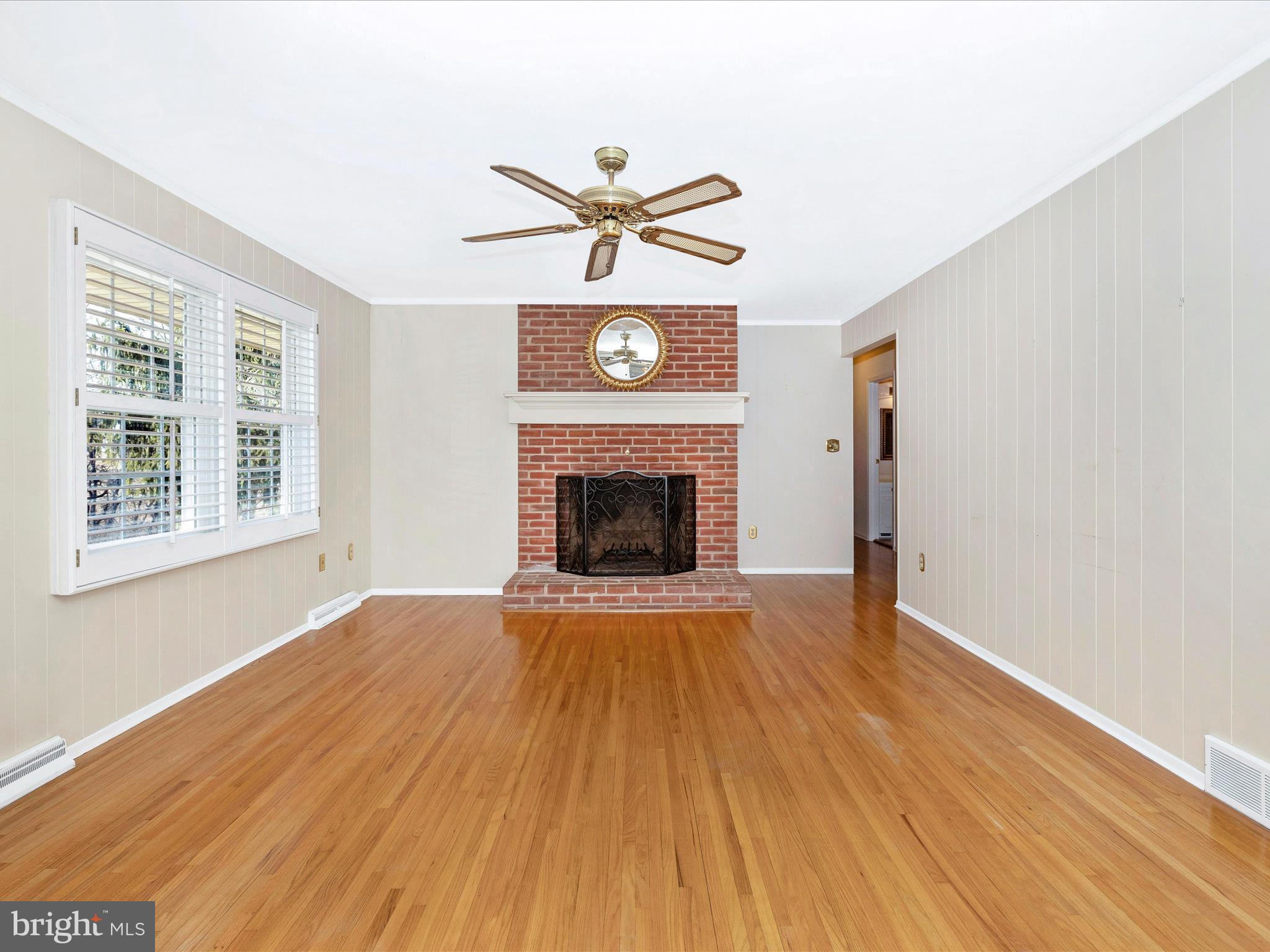 25204 Frederick Road Clarksburg, MD 20871 - Photo 21 of 58 a view of an empty room with a fireplace and a window