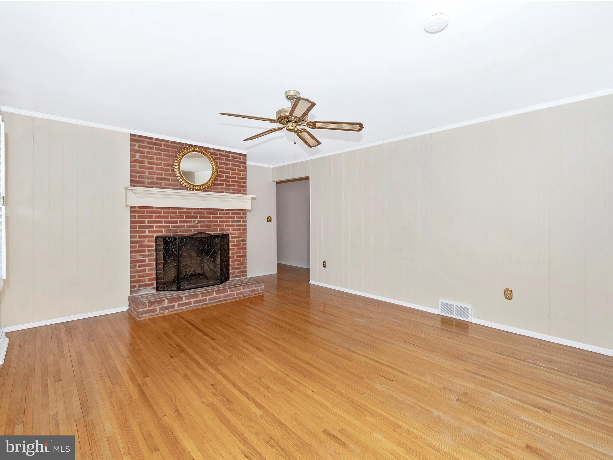 25204 Frederick Road Clarksburg, MD 20871 - Photo 22 of 58 a view of a livingroom with wooden floor and a fireplace