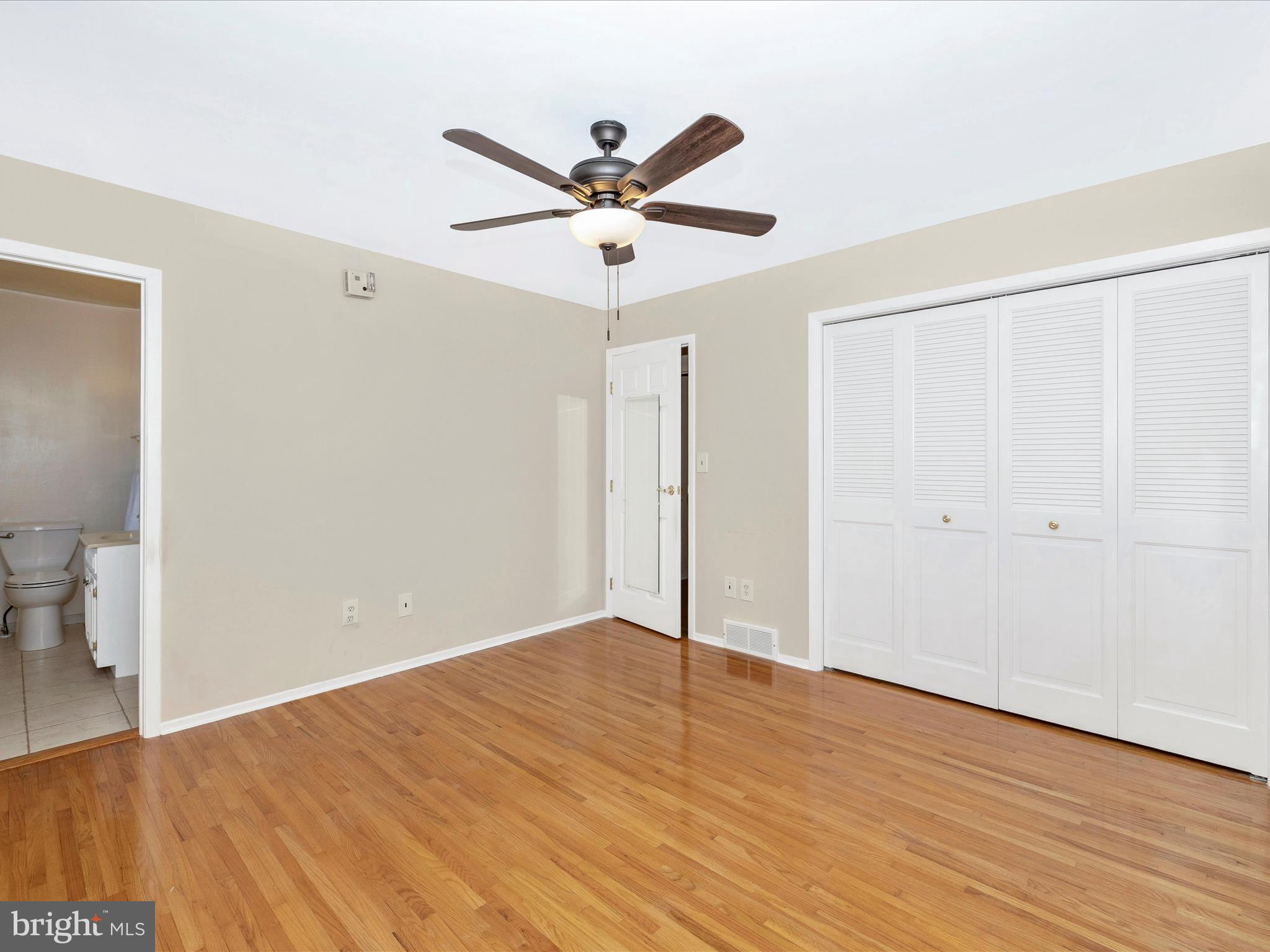 25204 Frederick Road Clarksburg, MD 20871 - Photo 26 of 58 a view of an empty room with wooden floor