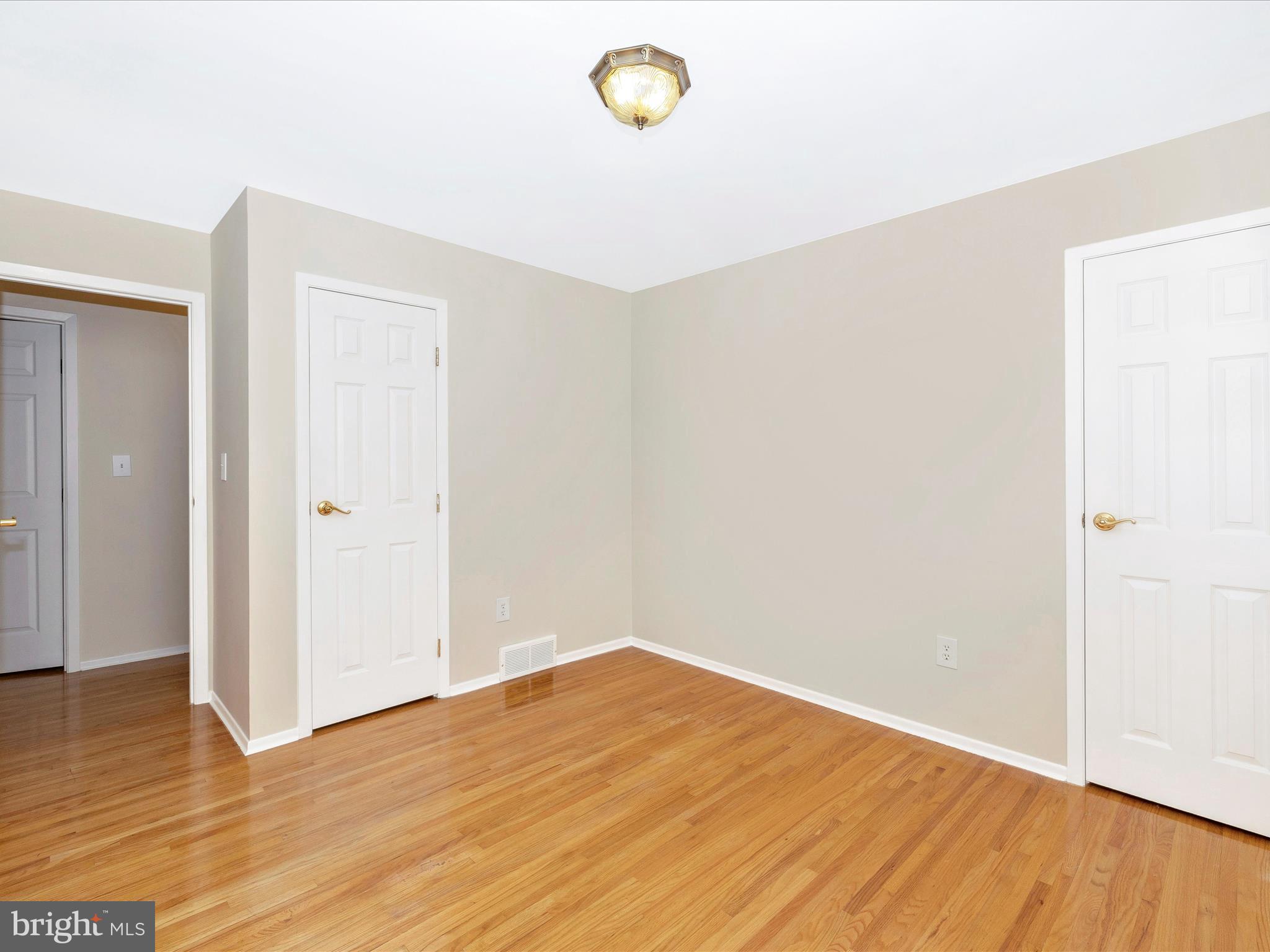 25204 Frederick Road Clarksburg, MD 20871 - Photo 34 of 58 a view of empty room with wooden floor