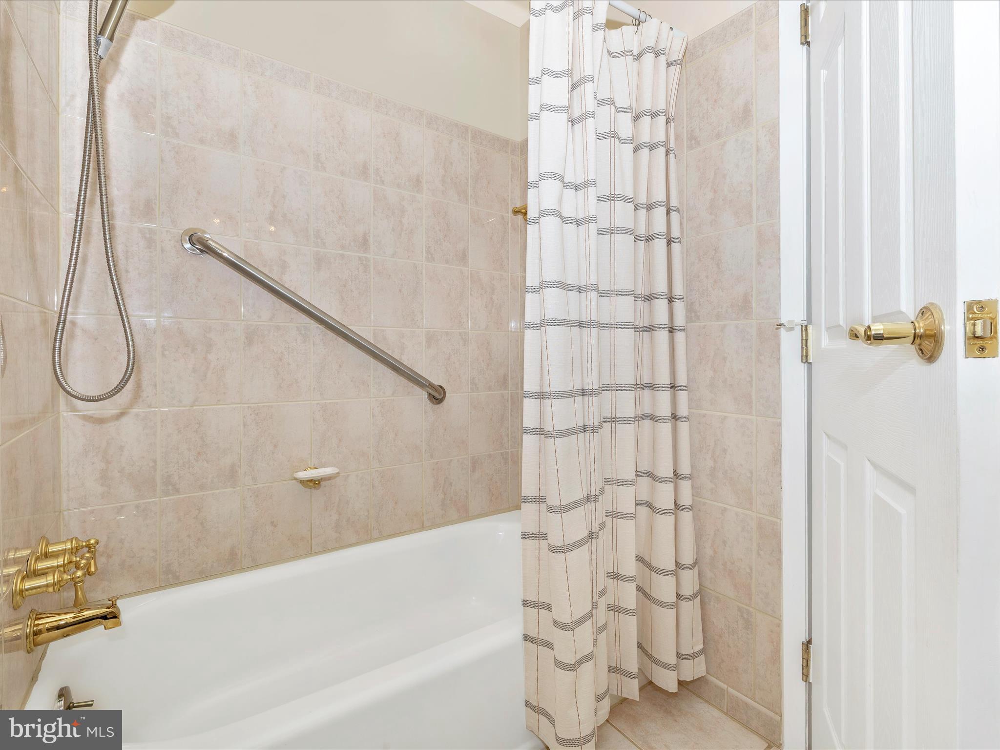 25204 Frederick Road Clarksburg, MD 20871 - Photo 36 of 58 a bathroom with a shower