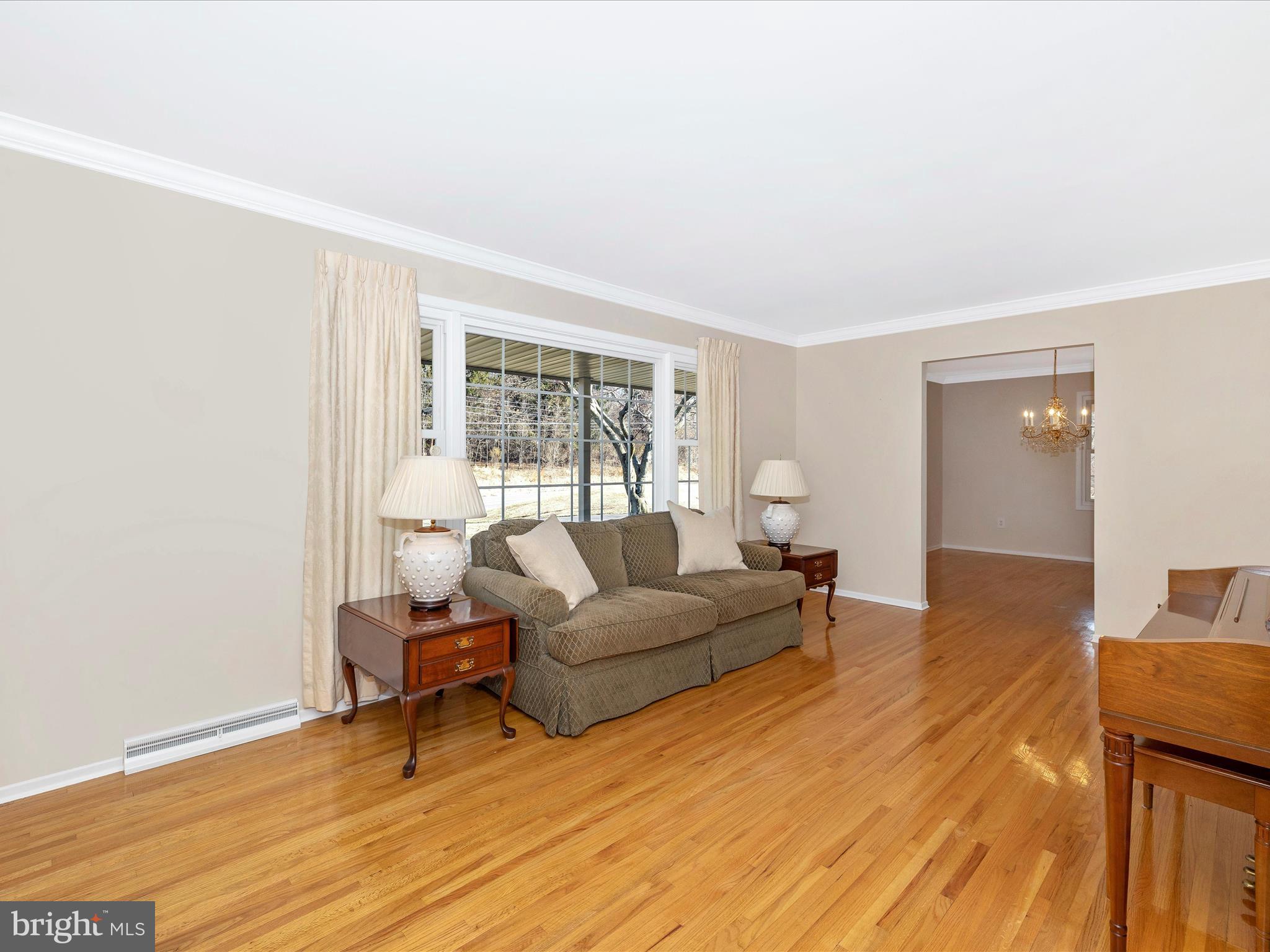 25204 Frederick Road Clarksburg, MD 20871 - Photo 6 of 58 a living room with furniture and a wooden floor