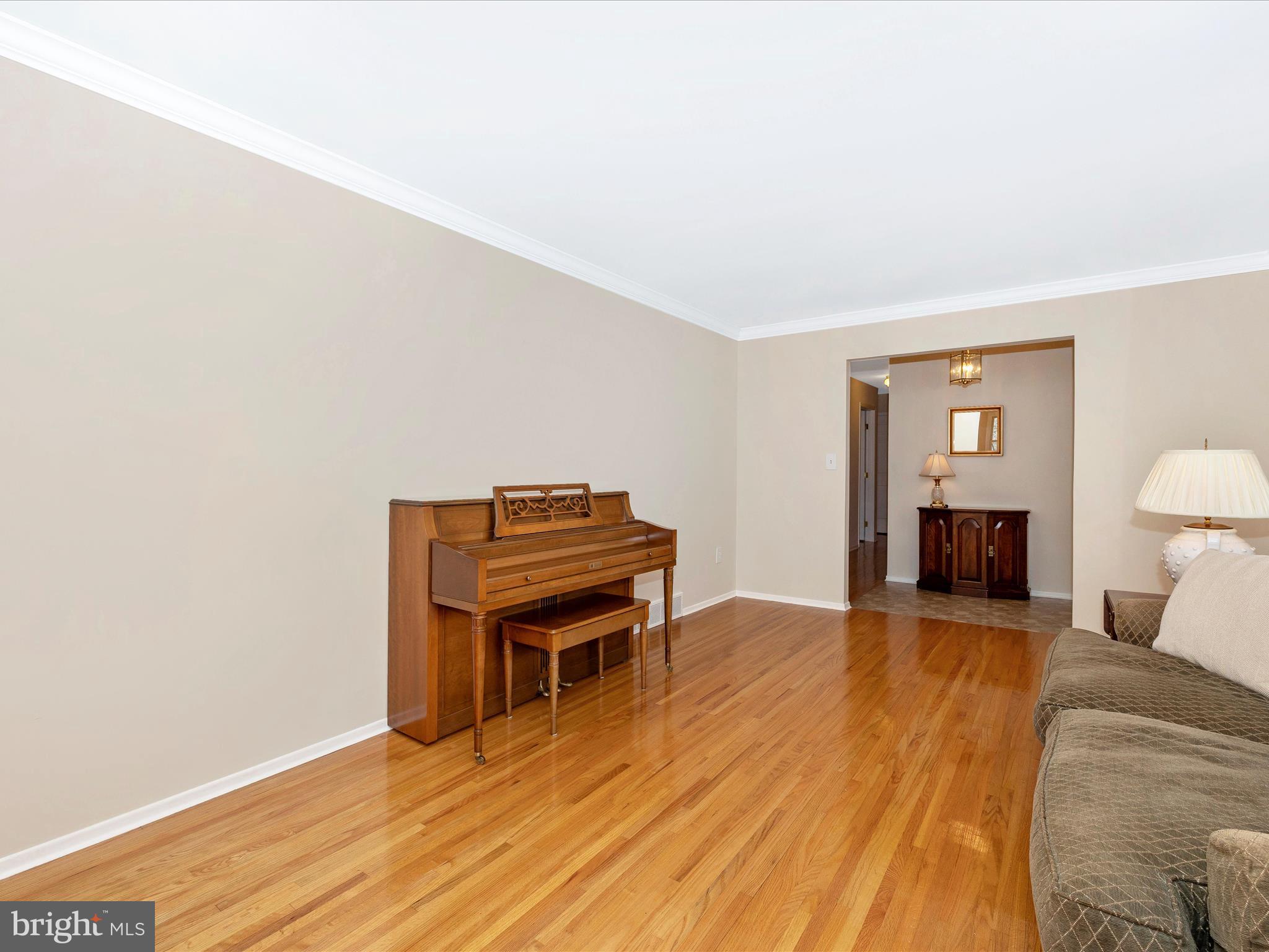 25204 Frederick Road Clarksburg, MD 20871 - Photo 7 of 58 a room with furniture and a wooden floor