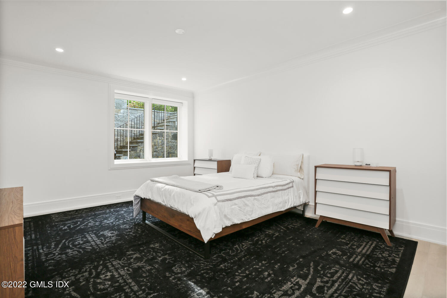 11 Turner Drive Greenwich, CT 06831 - Photo 27 of 35 a spacious bedroom with a bed and a window