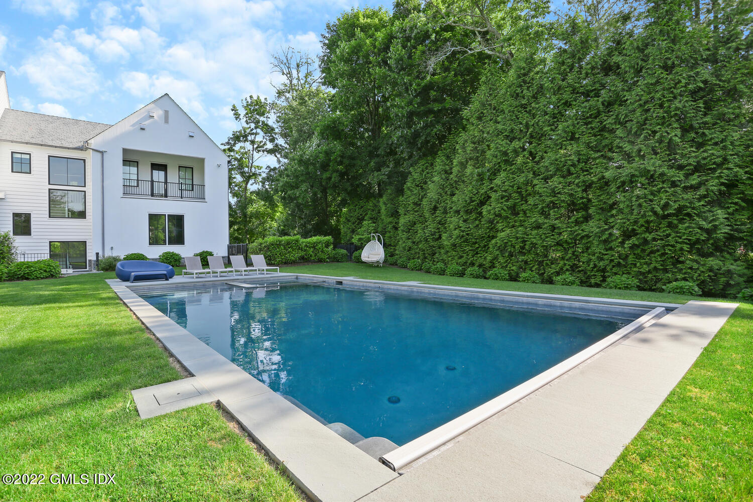 11 Turner Drive Greenwich, CT 06831 - Photo 30 of 35 a view of a swimming pool with a yard