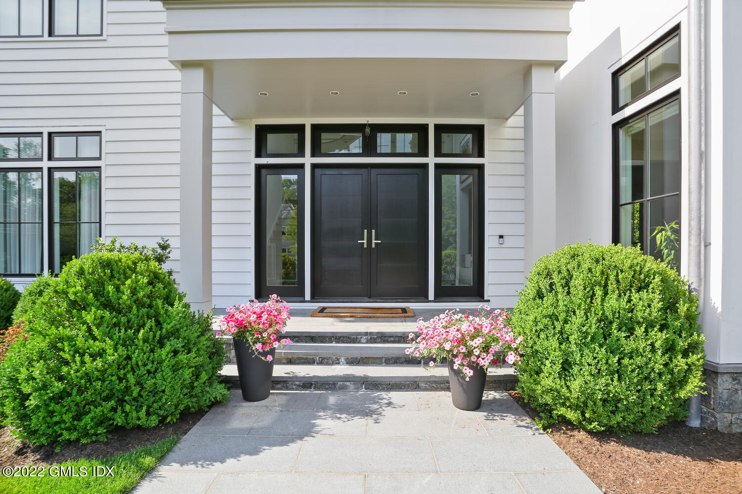 11 Turner Drive Greenwich, CT 06831 - Photo 3 of 35 a front view of a house with outdoor space