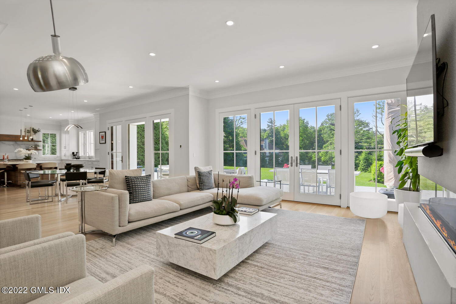 11 Turner Drive Greenwich, CT 06831 - Photo 10 of 35 a living room with furniture large windows and wooden floor
