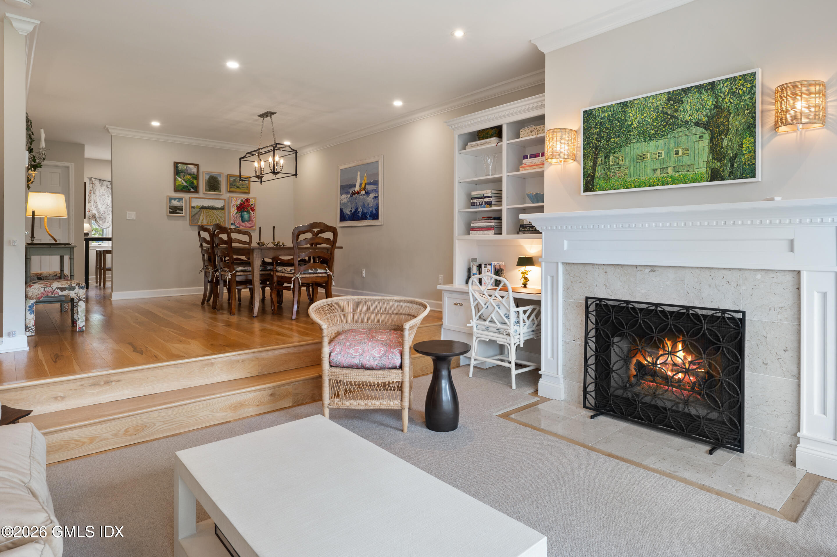 115 River Road, Unit 3 Cos Cob, CT 06807 - Photo 9 of 40 a living room with furniture a fireplace and kitchen view