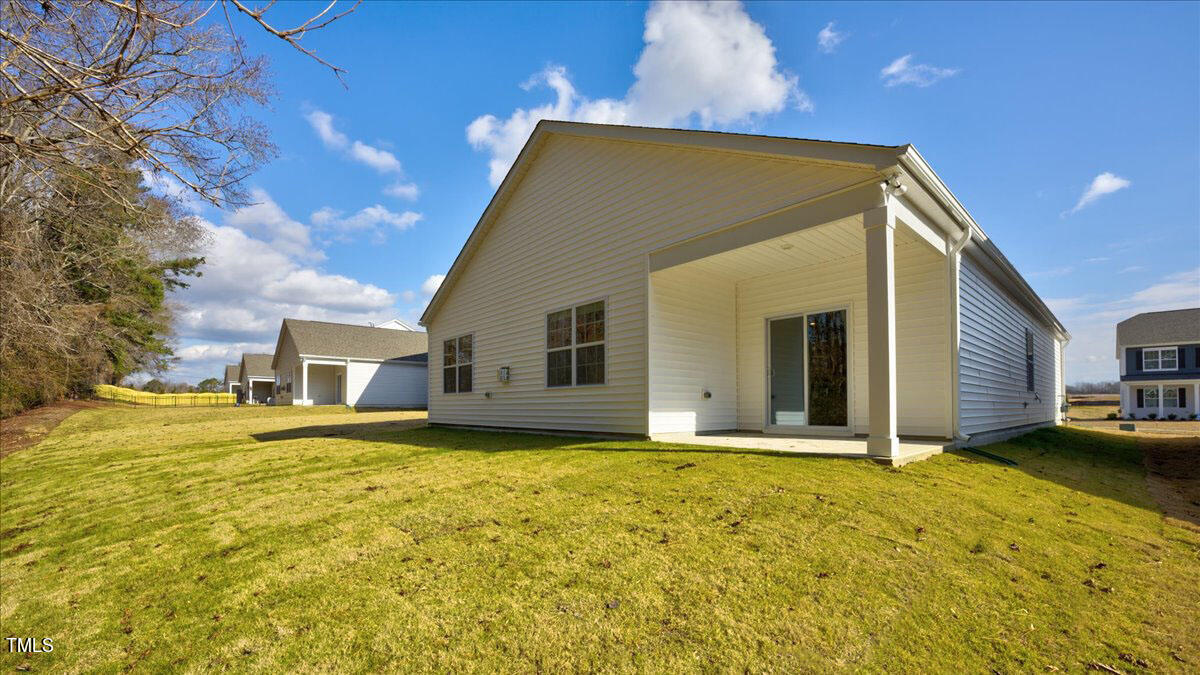 2208 Fletchers Ridge Drive Durham, NC 27703 - Photo 26 of 26 a view of a house with a yard
