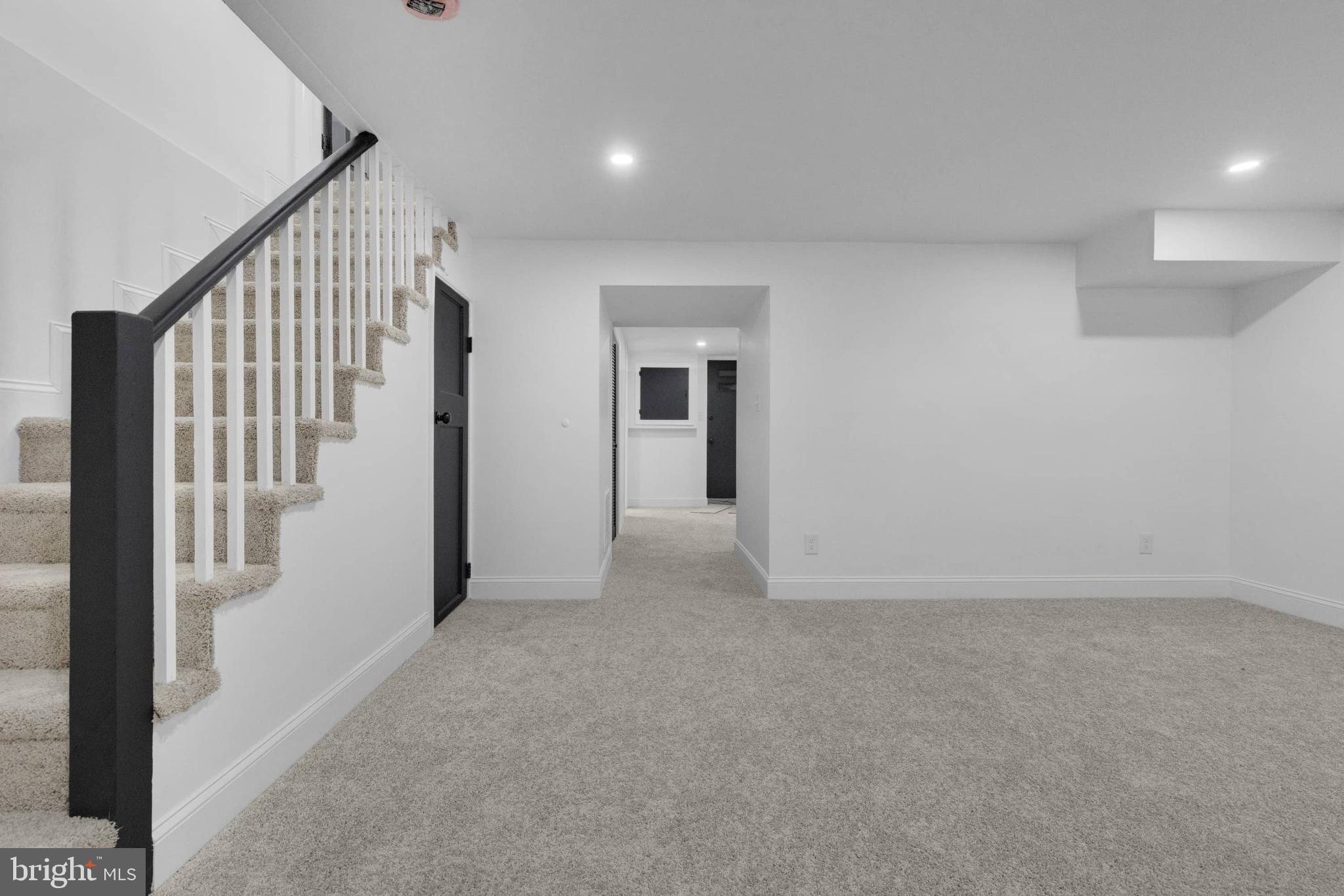 1403 Stonewood Road Baltimore, MD 21239 - Photo 20 of 36 a view of an empty room with stairs