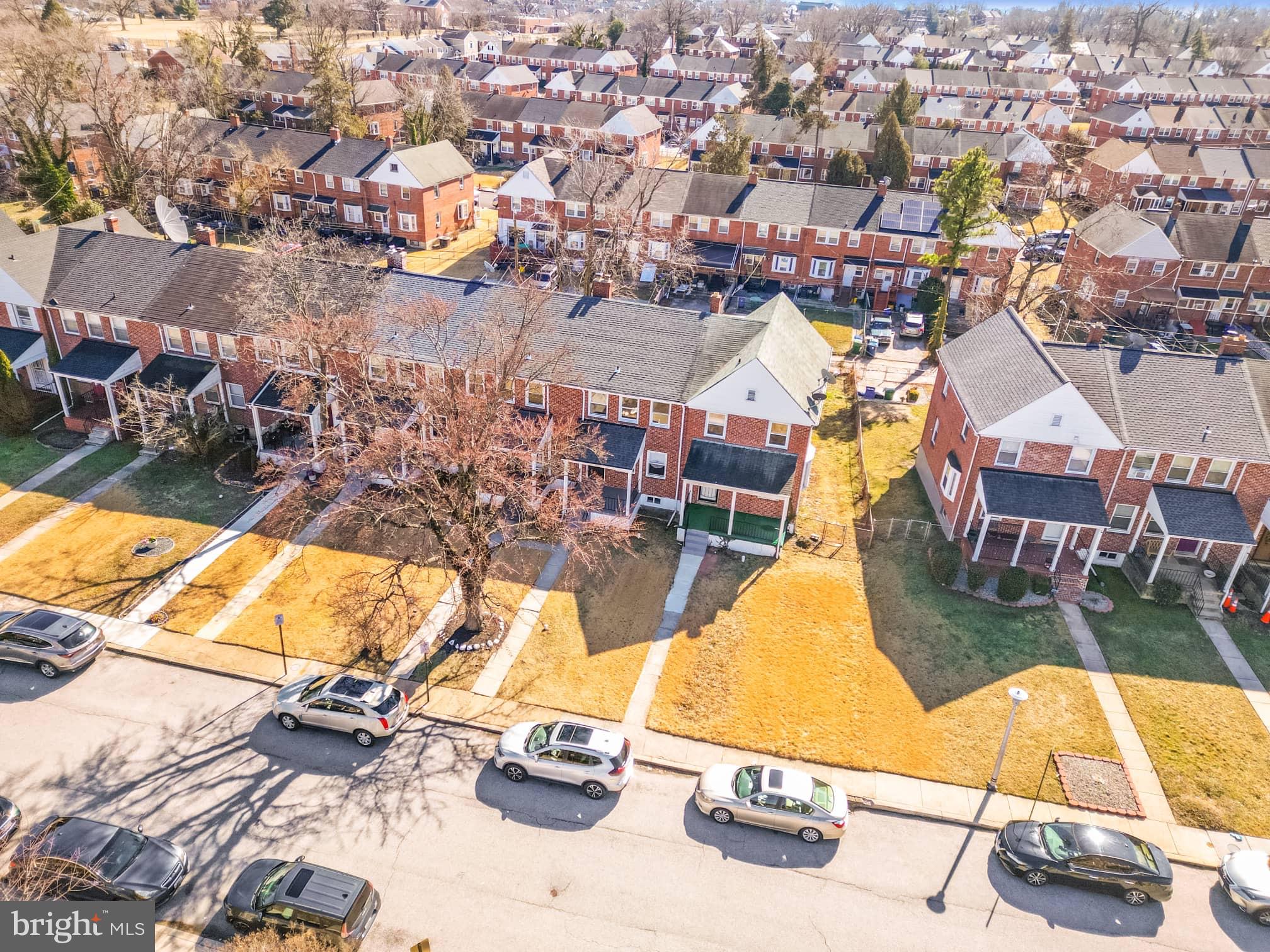 1403 Stonewood Road Baltimore, MD 21239 - Photo 2 of 36 an aerial view of residential houses with outdoor space