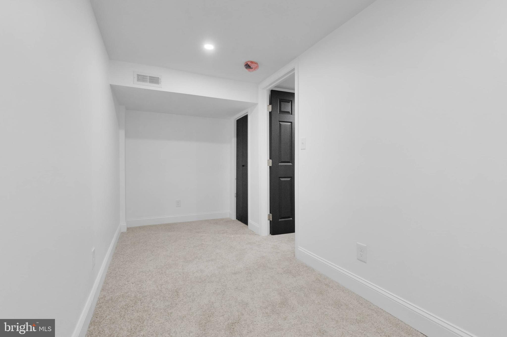 1403 Stonewood Road Baltimore, MD 21239 - Photo 22 of 36 a view of an empty room