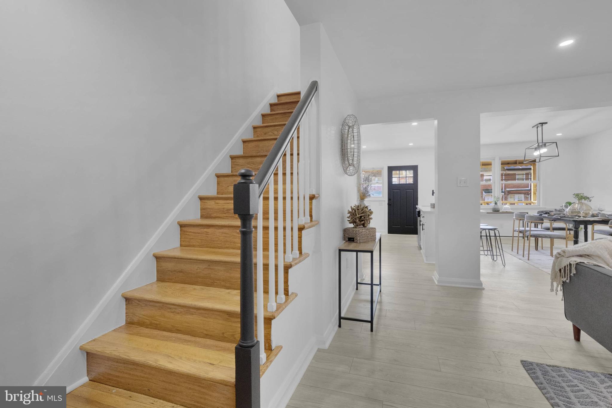 1403 Stonewood Road Baltimore, MD 21239 - Photo 25 of 36 a view of entryway and hall with wooden floor