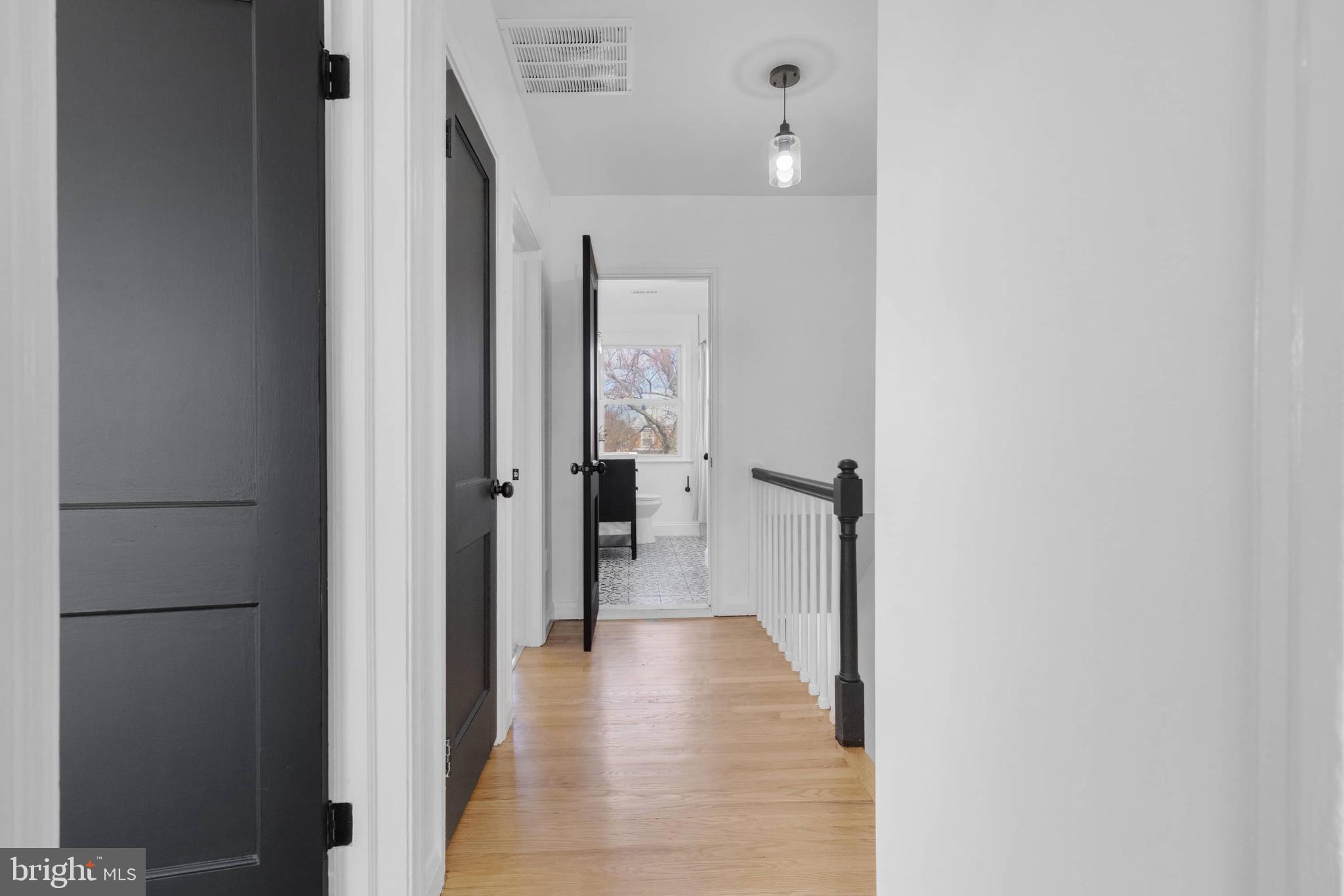 1403 Stonewood Road Baltimore, MD 21239 - Photo 26 of 36 a view of a hallway with a wooden cabinets