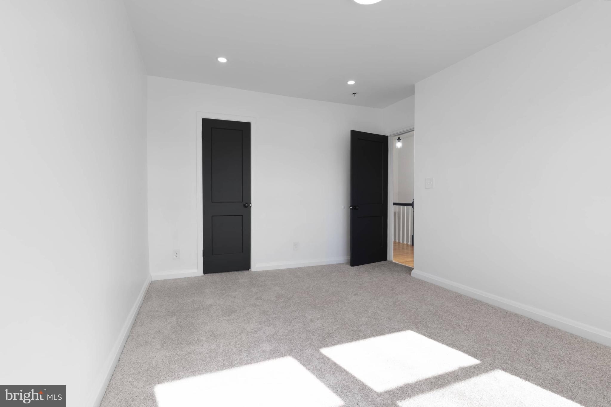 1403 Stonewood Road Baltimore, MD 21239 - Photo 28 of 36 a view of an empty room and window
