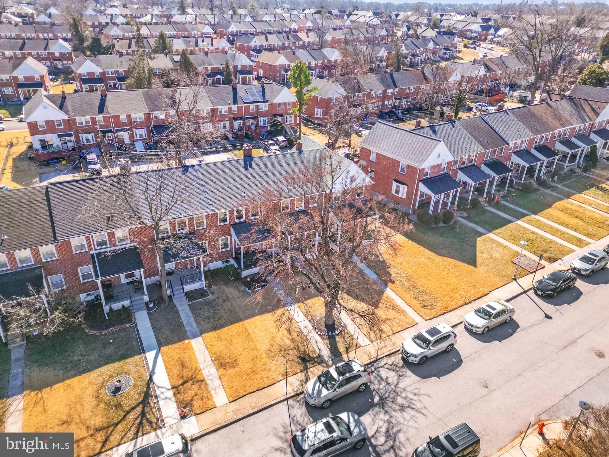 1403 Stonewood Road Baltimore, MD 21239 - Photo 3 of 36 an aerial view of residential houses with outdoor space