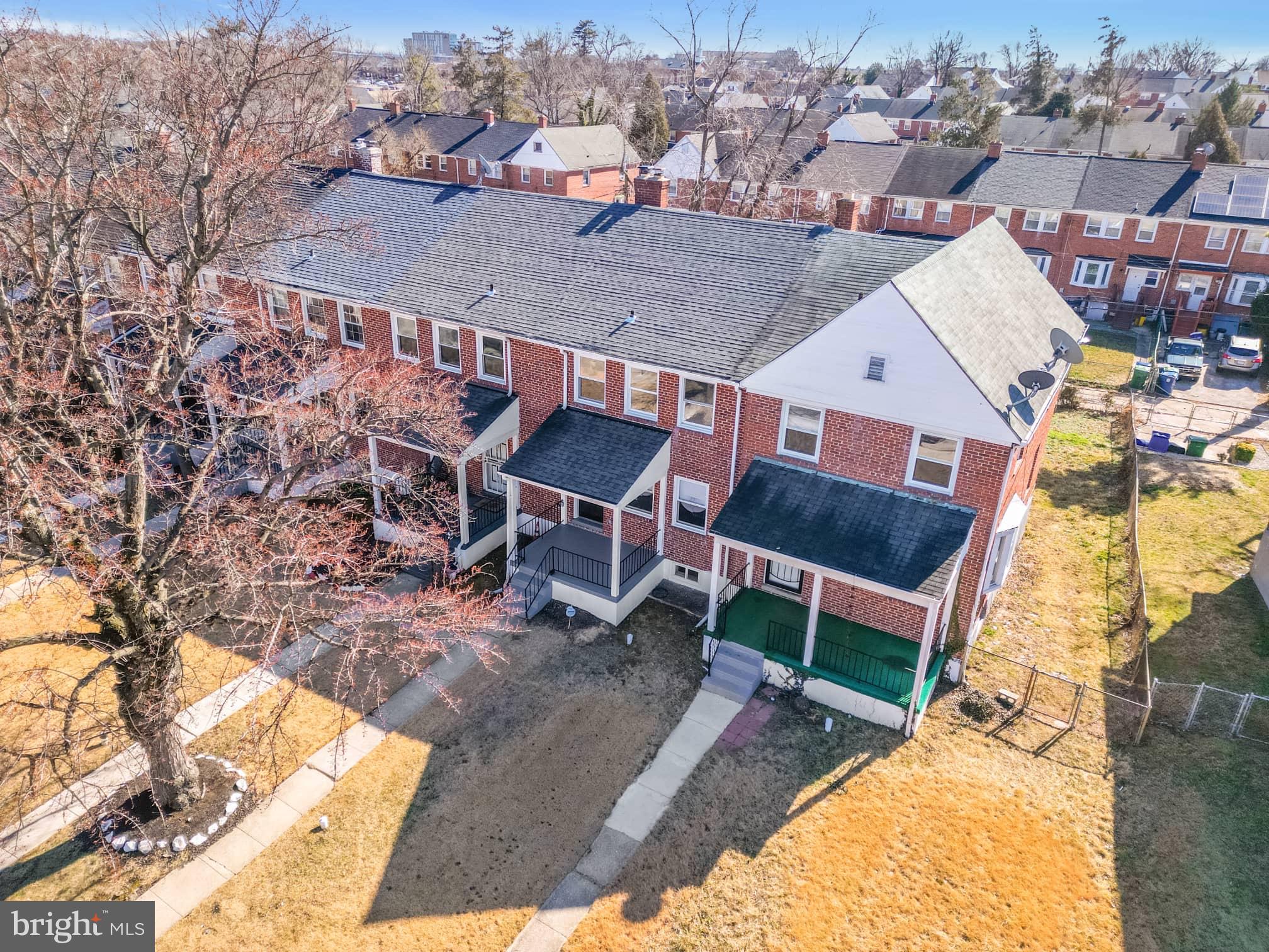 1403 Stonewood Road Baltimore, MD 21239 - Photo 4 of 36 an aerial view of a house with a yard and sitting space