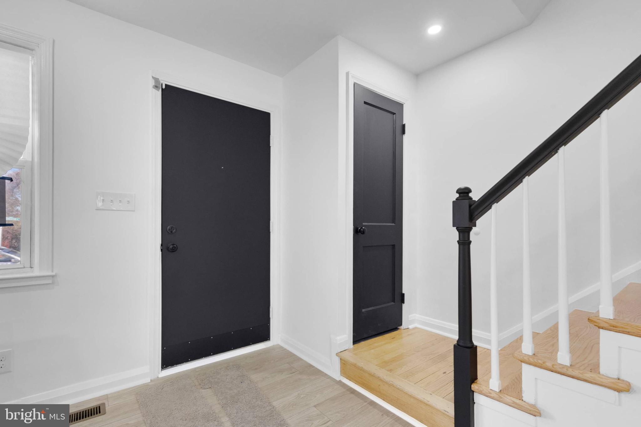 1403 Stonewood Road Baltimore, MD 21239 - Photo 5 of 36 a view of a hallway with a bedroom