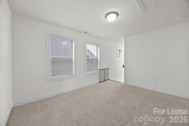 a bathroom with a double vanity sink mirror and shower