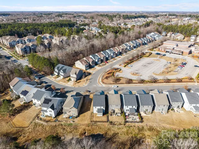 an aerial view of residential building and parking space
