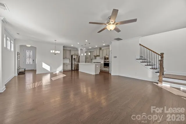 a view of an entryway with wooden floor