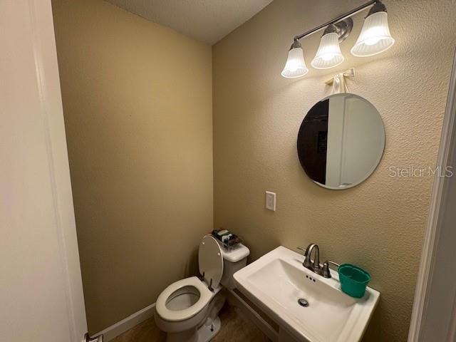 4825 Kimball Court East Lakeland, FL 33813 - Photo 12 of 26 a bathroom with a sink and a mirror
