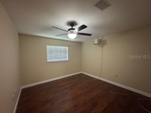 4825 Kimball Court East Lakeland, FL 33813 - Photo 15 of 26 an empty room with a window and a fan