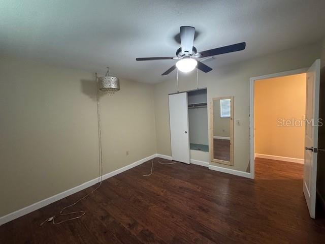 4825 Kimball Court East Lakeland, FL 33813 - Photo 16 of 26 an empty room with wooden floor fan and windows