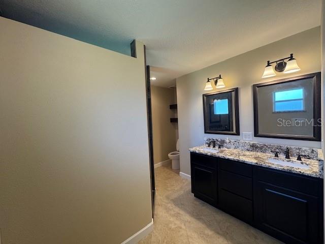 4825 Kimball Court East Lakeland, FL 33813 - Photo 18 of 26 a bathroom with a double vanity sink and a mirror