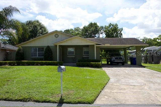 4825 Kimball Court East Lakeland, FL 33813 - Photo 2 of 26 a front view of a house with a yard