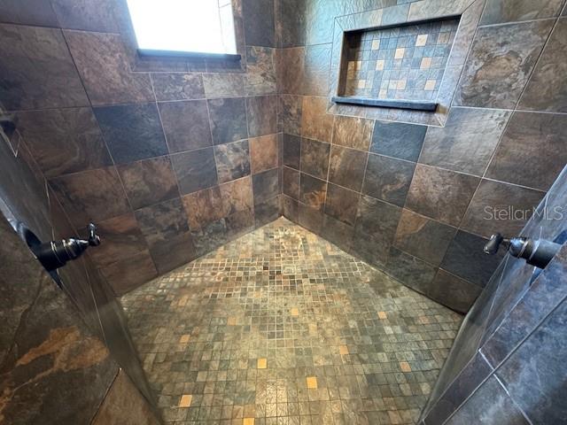 4825 Kimball Court East Lakeland, FL 33813 - Photo 21 of 26 a bathroom with a shower