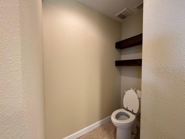 4825 Kimball Court East Lakeland, FL 33813 - Photo 22 of 26 a bathroom with a toilet and a sink
