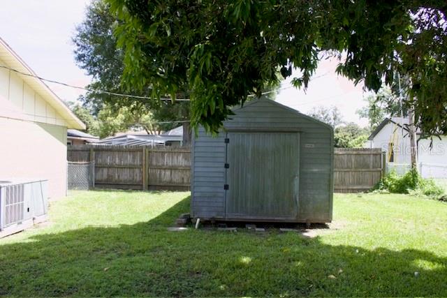 4825 Kimball Court East Lakeland, FL 33813 - Photo 24 of 26 a view of a backyard with a small cabin
