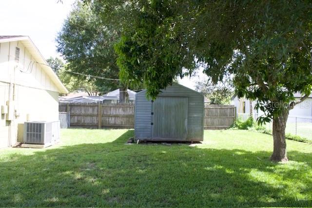 4825 Kimball Court East Lakeland, FL 33813 - Photo 25 of 26 a view of a backyard with a tree