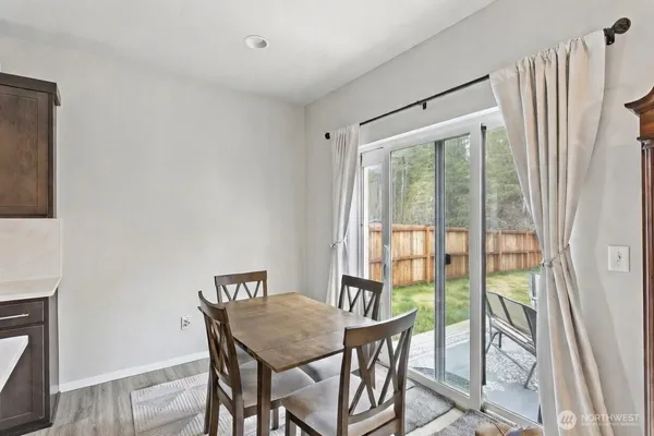 a view of a dining room with furniture window and outside view