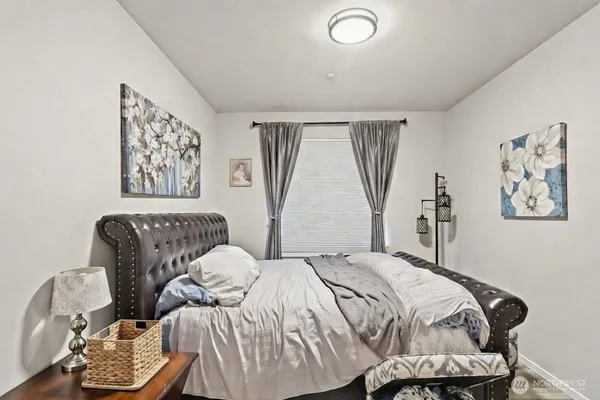 a bedroom with a bed and couch