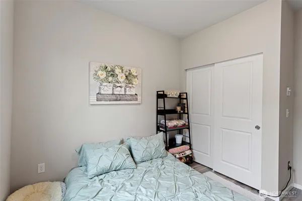 a bedroom with a bed and the view of bathroom