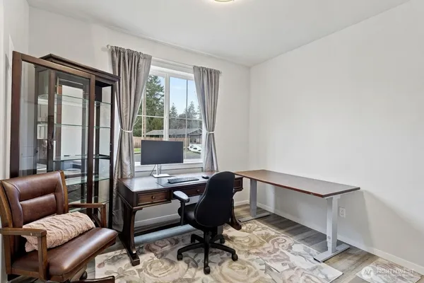 a workspace with furniture and a window