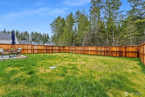 a view of outdoor space with deck and yard