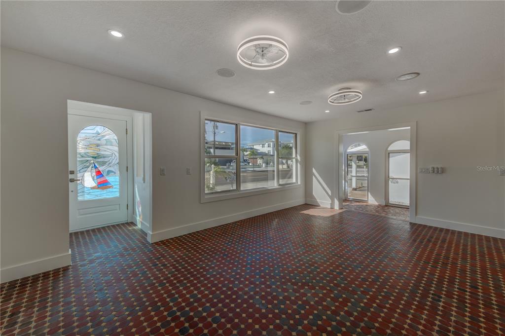 16245 Gulf Boulevard Redington Beach, FL 33708 - Photo 15 of 30 an empty room with wooden floor and windows