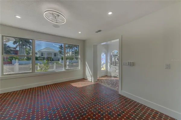 a kitchen with a refrigerator a sink and cabinets