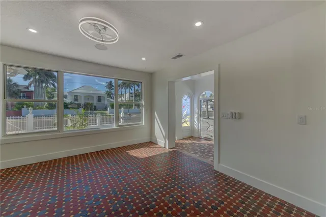 a kitchen with a refrigerator a sink and cabinets