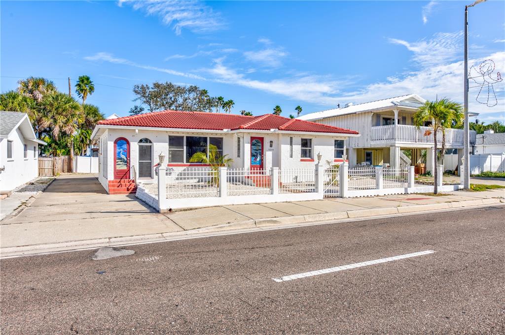 16245 Gulf Boulevard Redington Beach, FL 33708 - Photo 2 of 30 a front view of a building with street