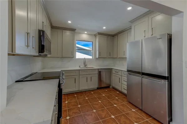 a view of a hallway with washer and dryer