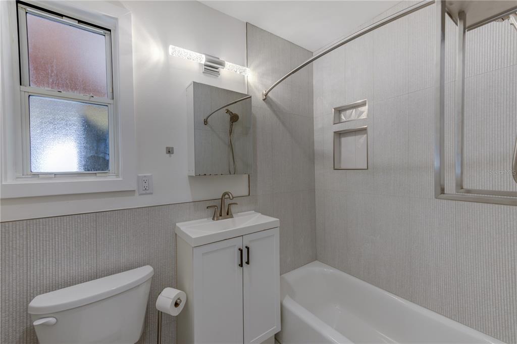 16245 Gulf Boulevard Redington Beach, FL 33708 - Photo 23 of 30 a bathroom with a sink a toilet and shower