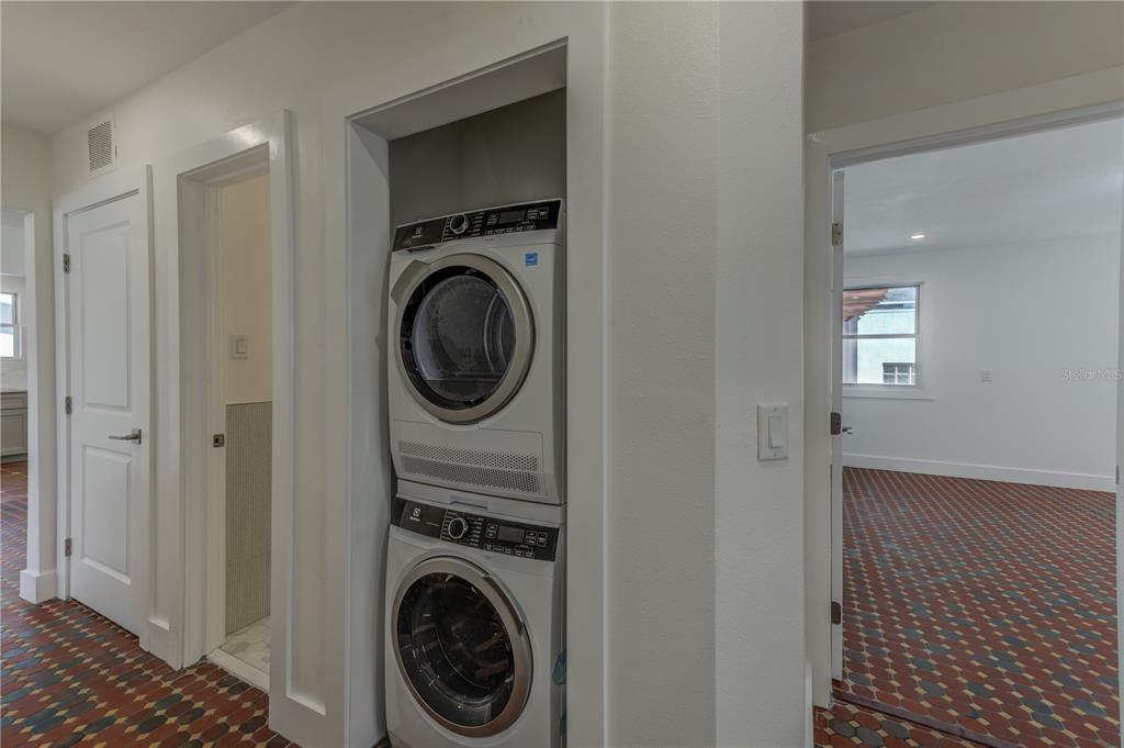 16245 Gulf Boulevard Redington Beach, FL 33708 - Photo 24 of 30 a view of a hallway with washer and dryer