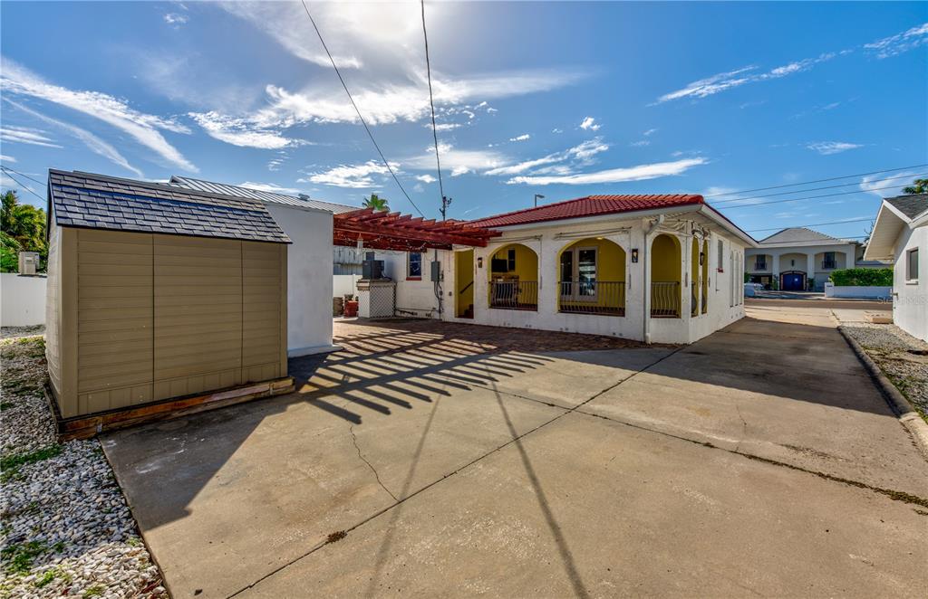 16245 Gulf Boulevard Redington Beach, FL 33708 - Photo 6 of 30 a view of a house with a patio and a chandelier