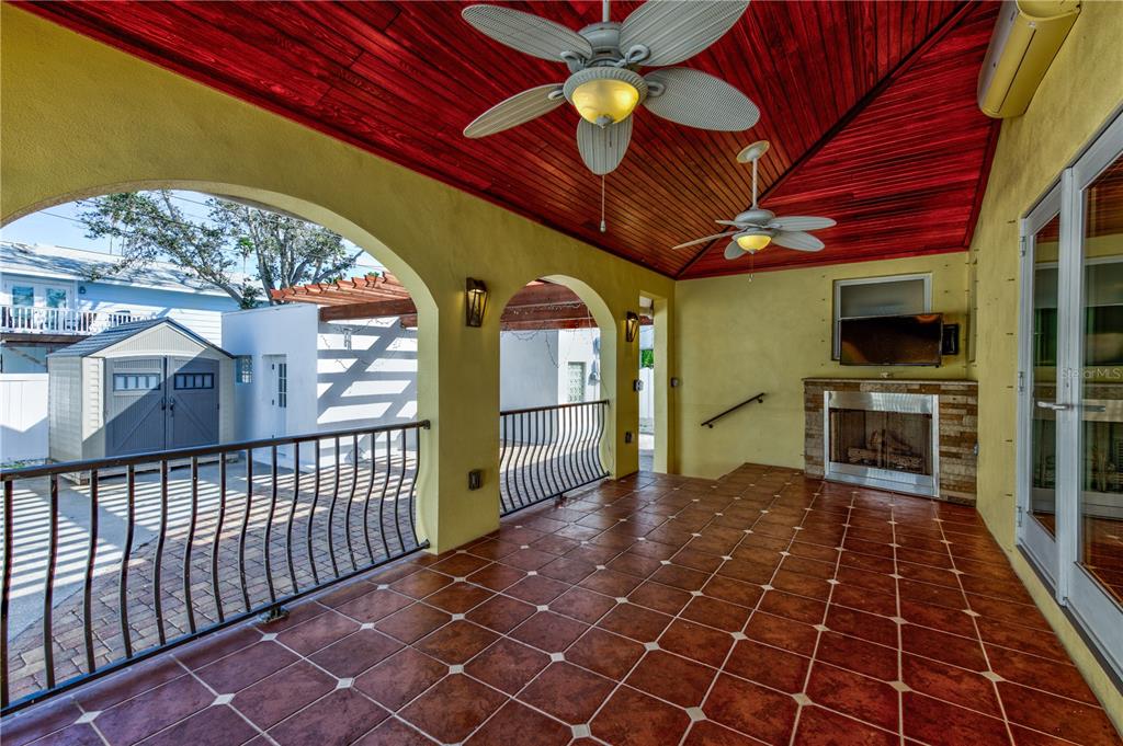 16245 Gulf Boulevard Redington Beach, FL 33708 - Photo 7 of 30 a view of a porch with furniture and a table