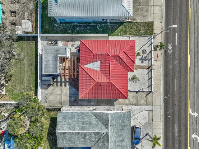 a kitchen with stainless steel appliances a refrigerator and wooden floor